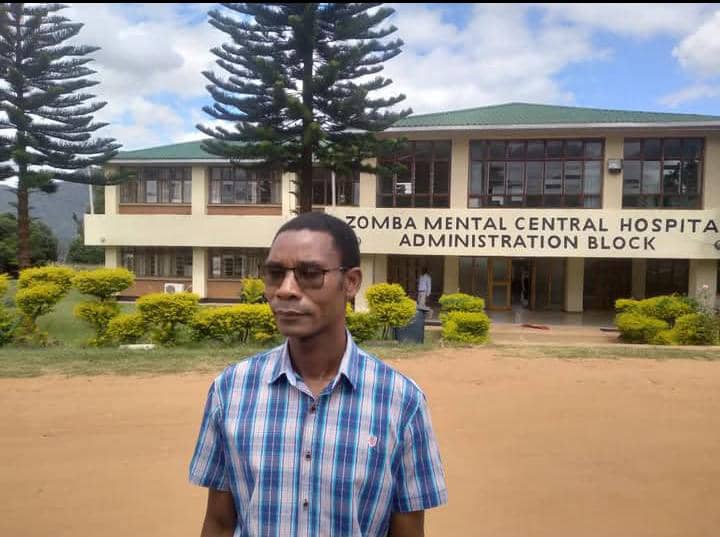 Harry Kawiya in front of Zomba Mental Hospital